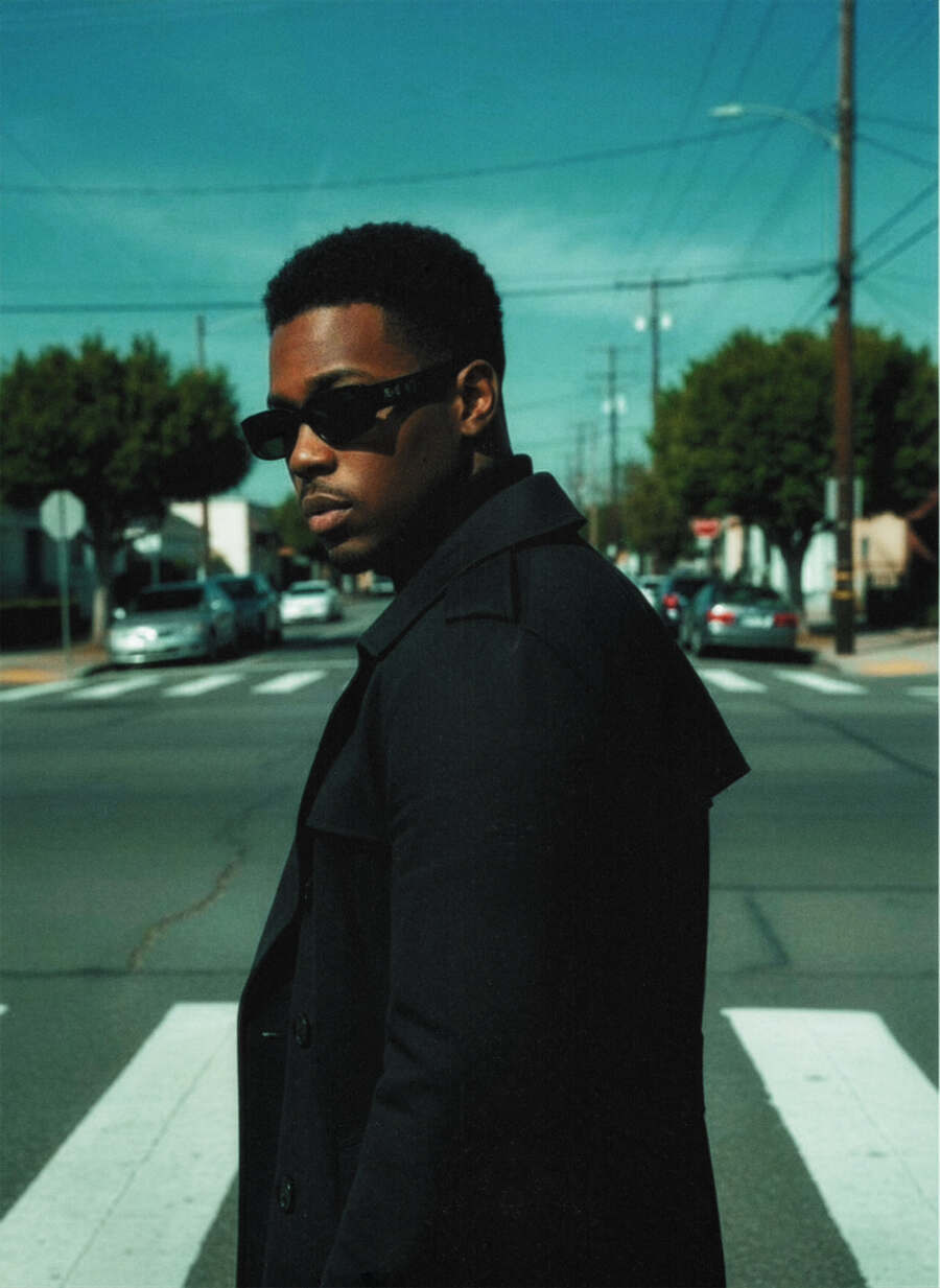K.R.W.N. — cinematic portrait, black trench coat, faith-centered artist